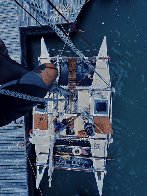 left is a sailing pueo handmade of wood, middle is a photo of wood projects for the canoe being clamped, and right is a photo from chriss POV of him climbing the mast to fix something he miscalculated on purpose to climb the mast