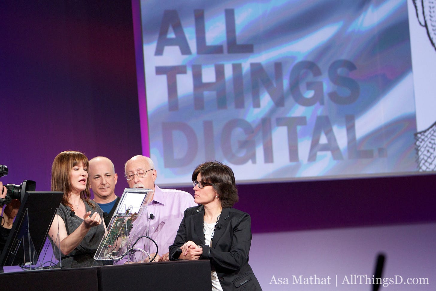On stage showing the plastic see through tablet demonstrated by Julie Larson Green. Also visible Walt Mossberg, Kara Swisher (looking grumpy). I'm in the background. On stage showing the plastic see through tablet demonstrated by Julie Larson Green. Also visible Walt Mossberg, Kara Swisher (looking grumpy). I'm in the background.