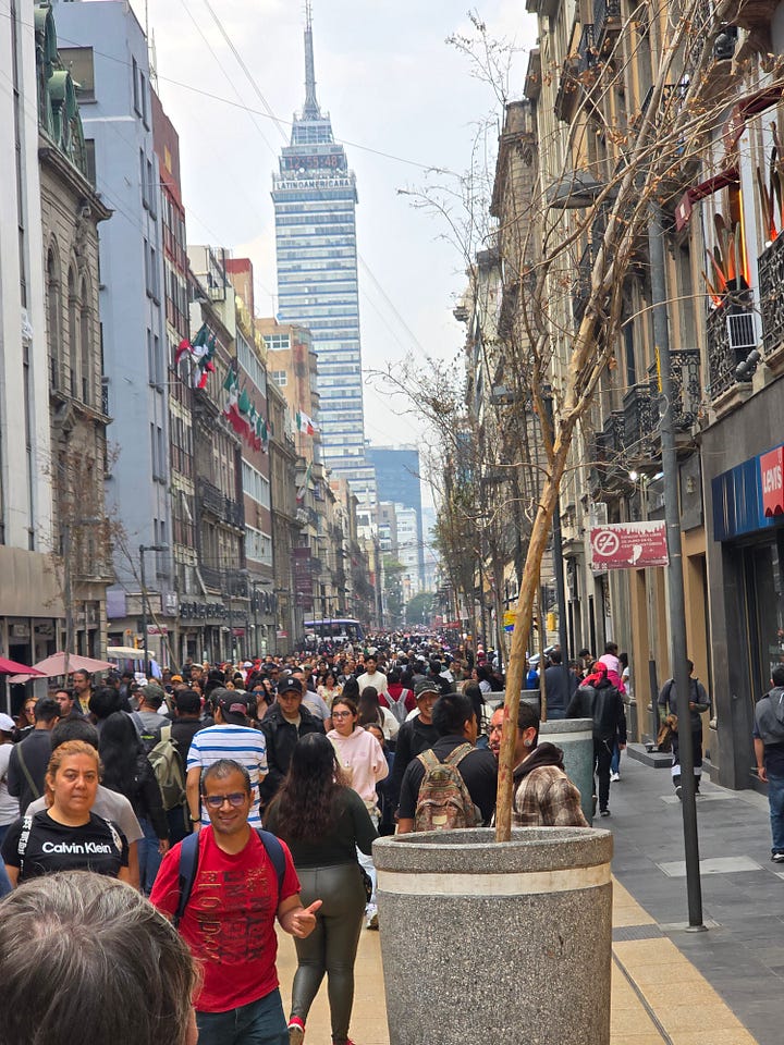 Avenida Francisco I. Madero, statue of the namesake, throngs of pedestrians, blue tiles