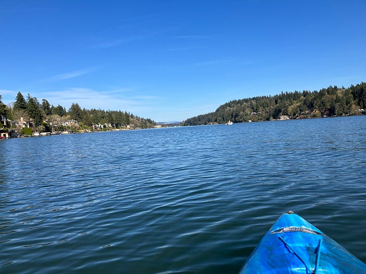 Images of Lake Oswego, Oregon and people paddling in kayaks