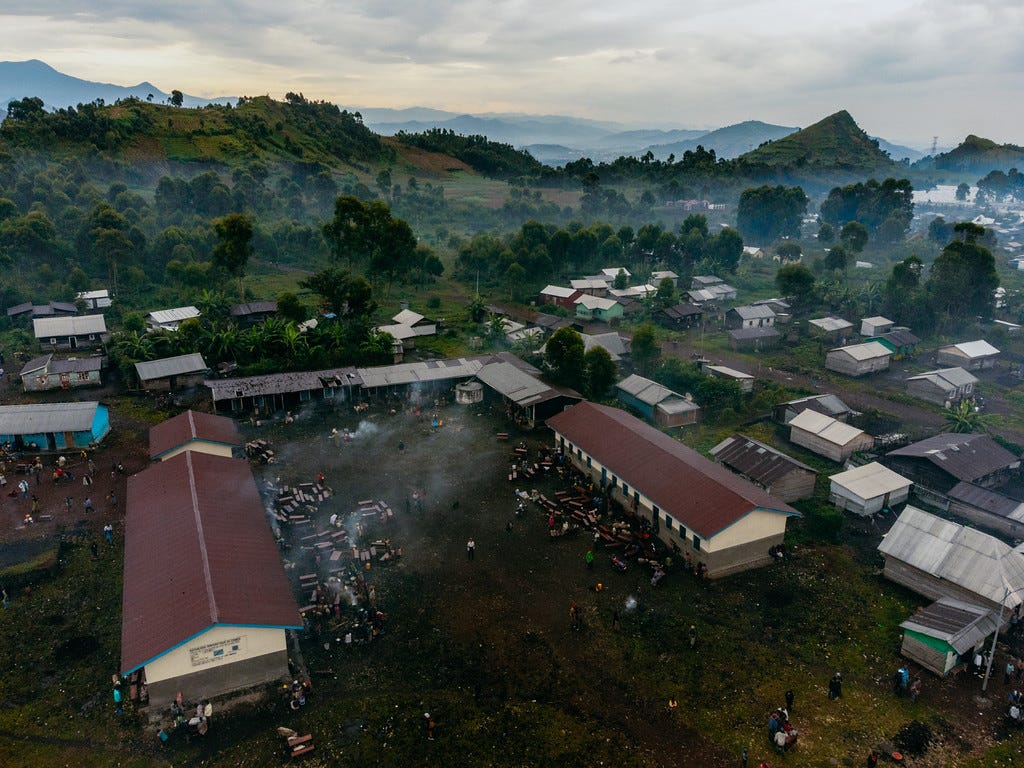Newly displaced families seeking shelter in a school in Munigi Newly displaced families seeking shelter in a school in Munigi