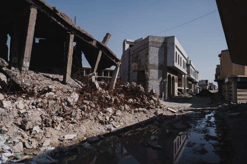 View of typical ruins in the Old City of Mosul after war with the Islamic State, as well as signs of reconstruction.