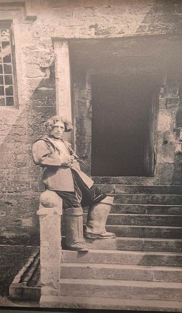 A person sitting on a stone staircase

AI-generated content may be incorrect.