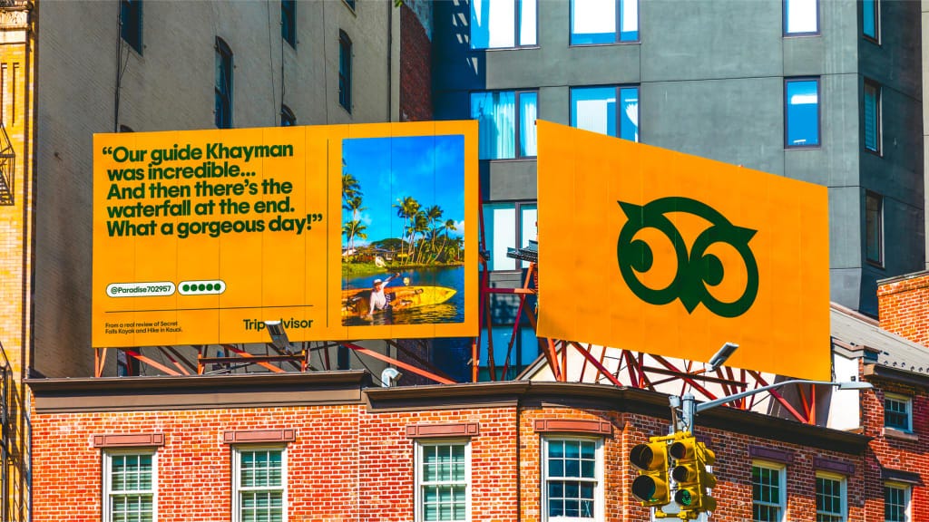 Billboards from Tripadvisor's new out of home campaign, featuring rebranded creative assets and electric orange background.