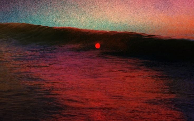 This may contain: the sun is setting behind a wave in the ocean