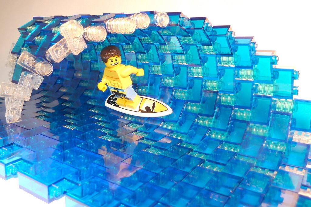 Lego figure surfing through a barrel wave Lego figure surfing through a barrel wave
