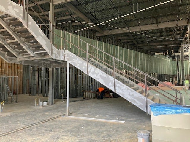 pictures of sports center construction, final look, and logo