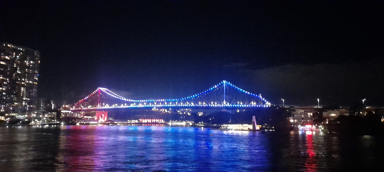 Photo of Brisbane's Story Bridge, lit up with stripes representing global average temperatures over 100 years Photo of Brisbane's Story Bridge, lit up with stripes representing global average temperatures over 100 years