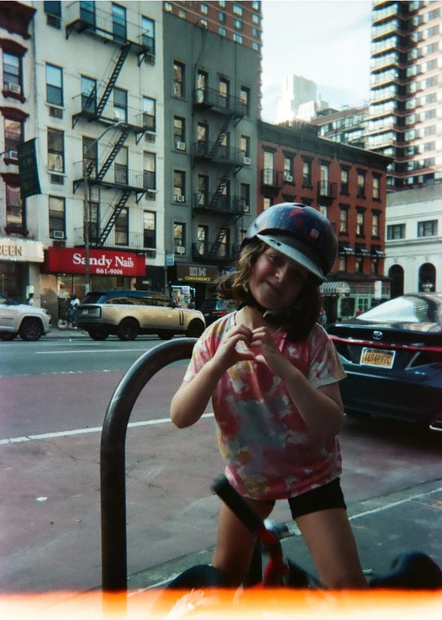 heart hands by girl on a bike