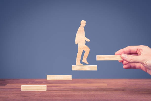 personal growth - man climbing up the stairs