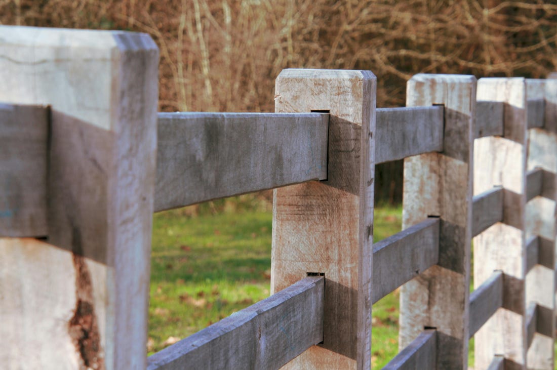 Weathered wooden fence posts and rails marking a boundary along an open field, illustrating business non-negotiables. Weathered wooden fence posts and rails marking a boundary along an open field, illustrating business non-negotiables.