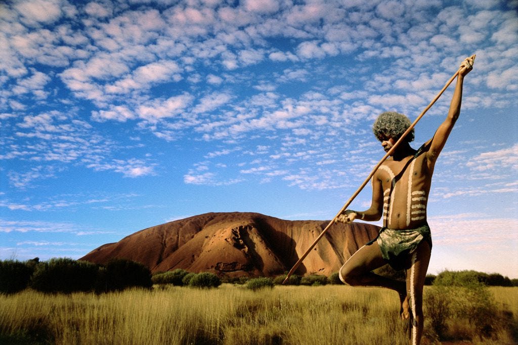 An Australian Aboriginee all painted showing his native culture. Embracing history and culture are wonderful ways to explore the world.