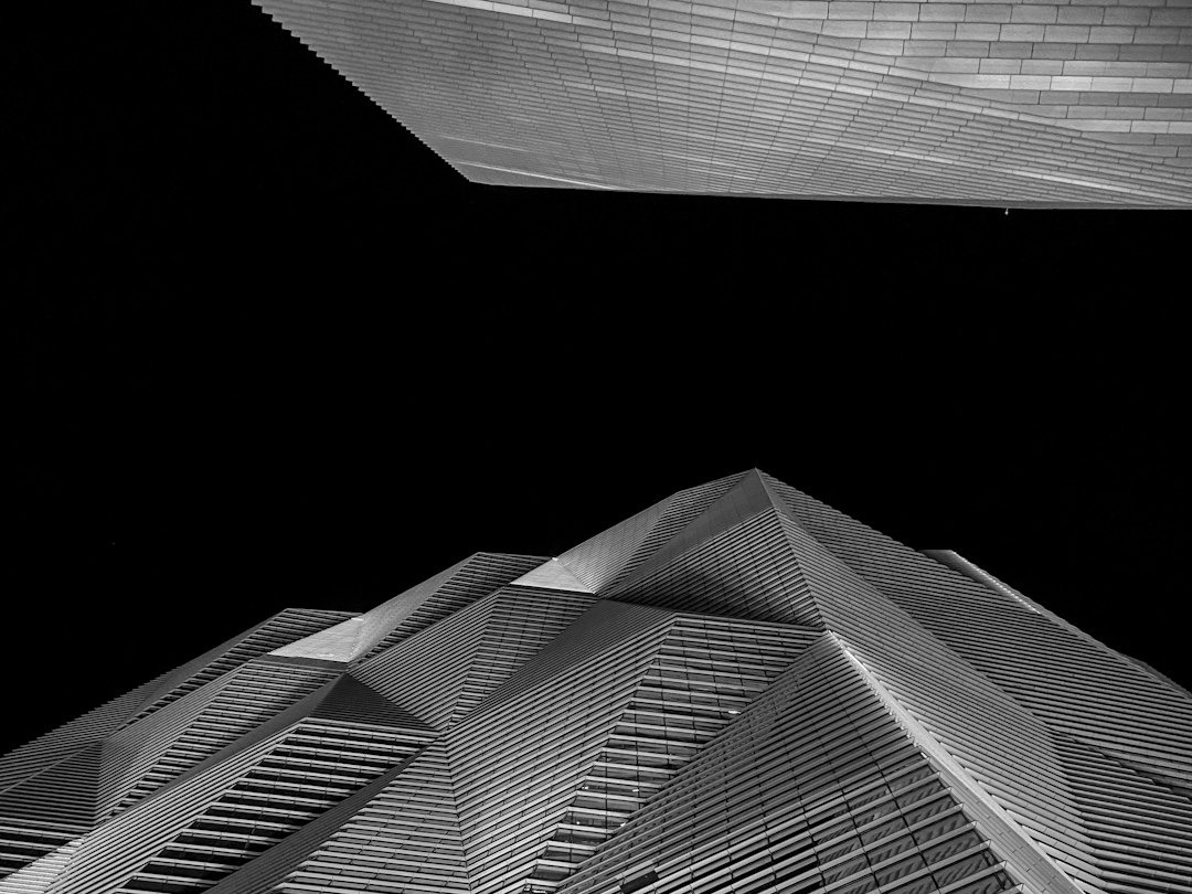 a black and white photo of a tall building a black and white photo of a tall building