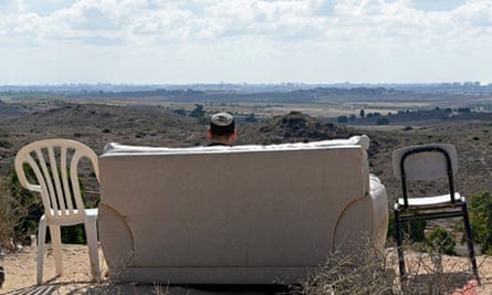 Israeli watches Gaza bombing from hillside sofa Israeli watches Gaza bombing from hillside sofa