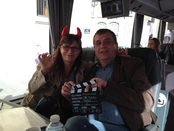 movies in Paris Jacqueline and Michel with props for group photo