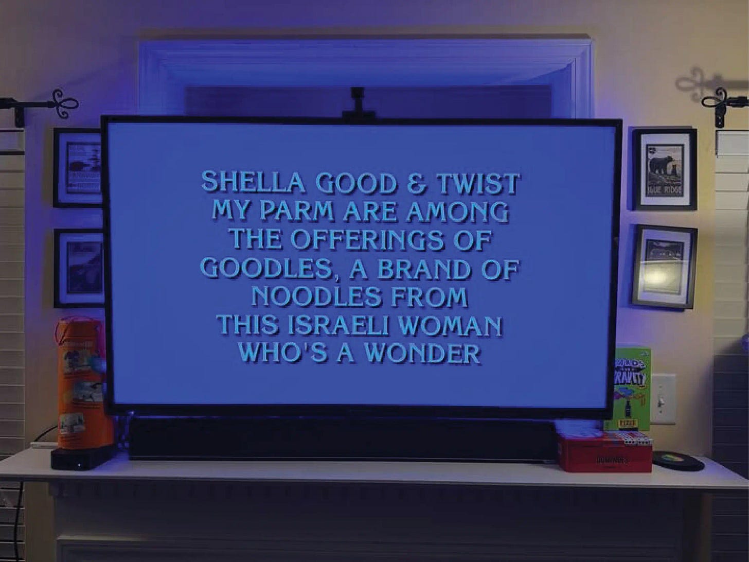 Jeopardy answer on a TV that says "Shella Good & Twist My Parm are among the offerings of Goodles, a brand of noodles from this Israeli woman who's a wonder"