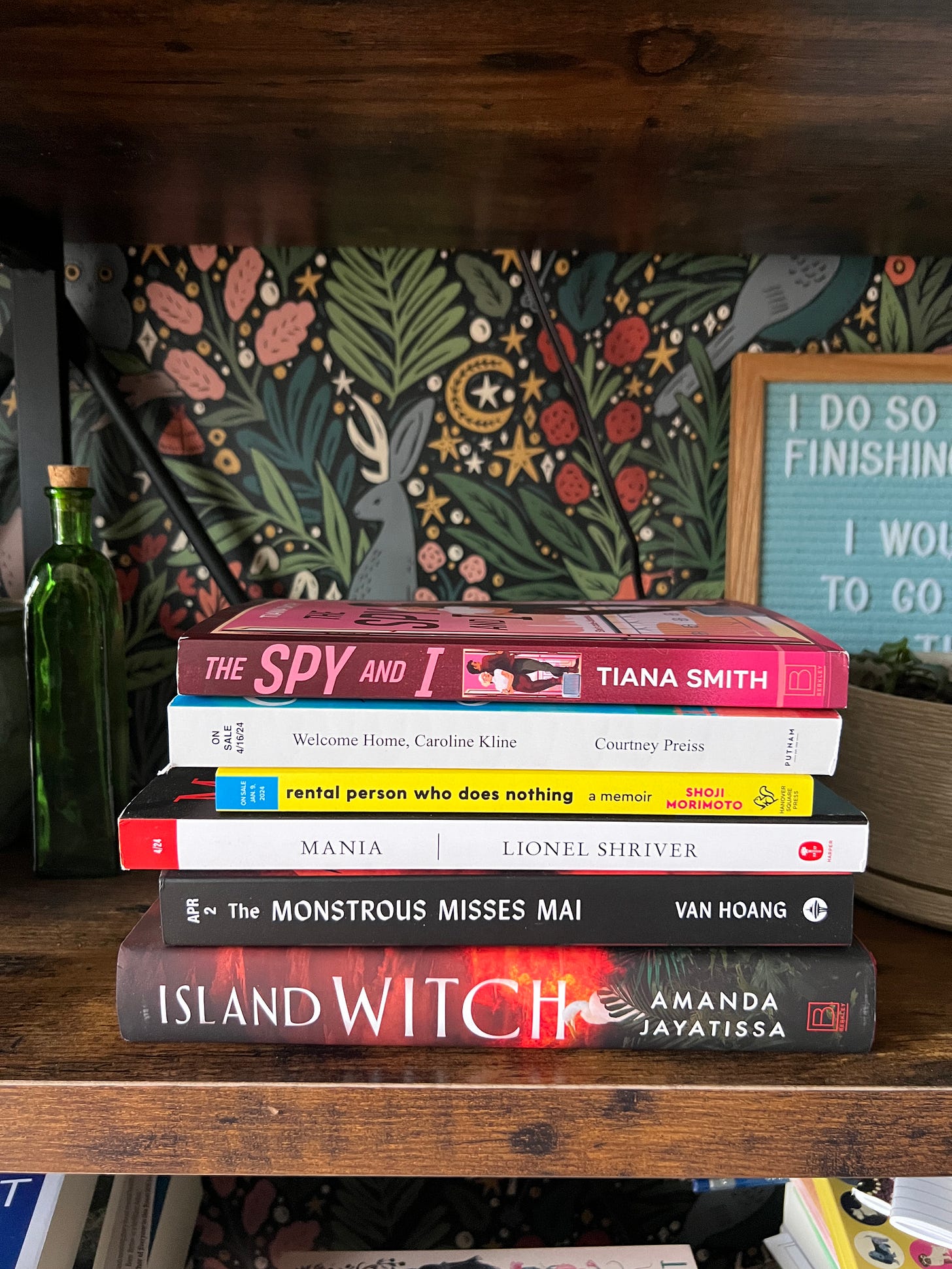 Book stack of books and ARCs that includes: The Spy and I, Welcome Home Caroline Kline, Rental Person Who Does Nothing, Mania, the Monstrous Misses Mai, and Island Witch Book stack of books and ARCs that includes: The Spy and I, Welcome Home Caroline Kline, Rental Person Who Does Nothing, Mania, the Monstrous Misses Mai, and Island Witch