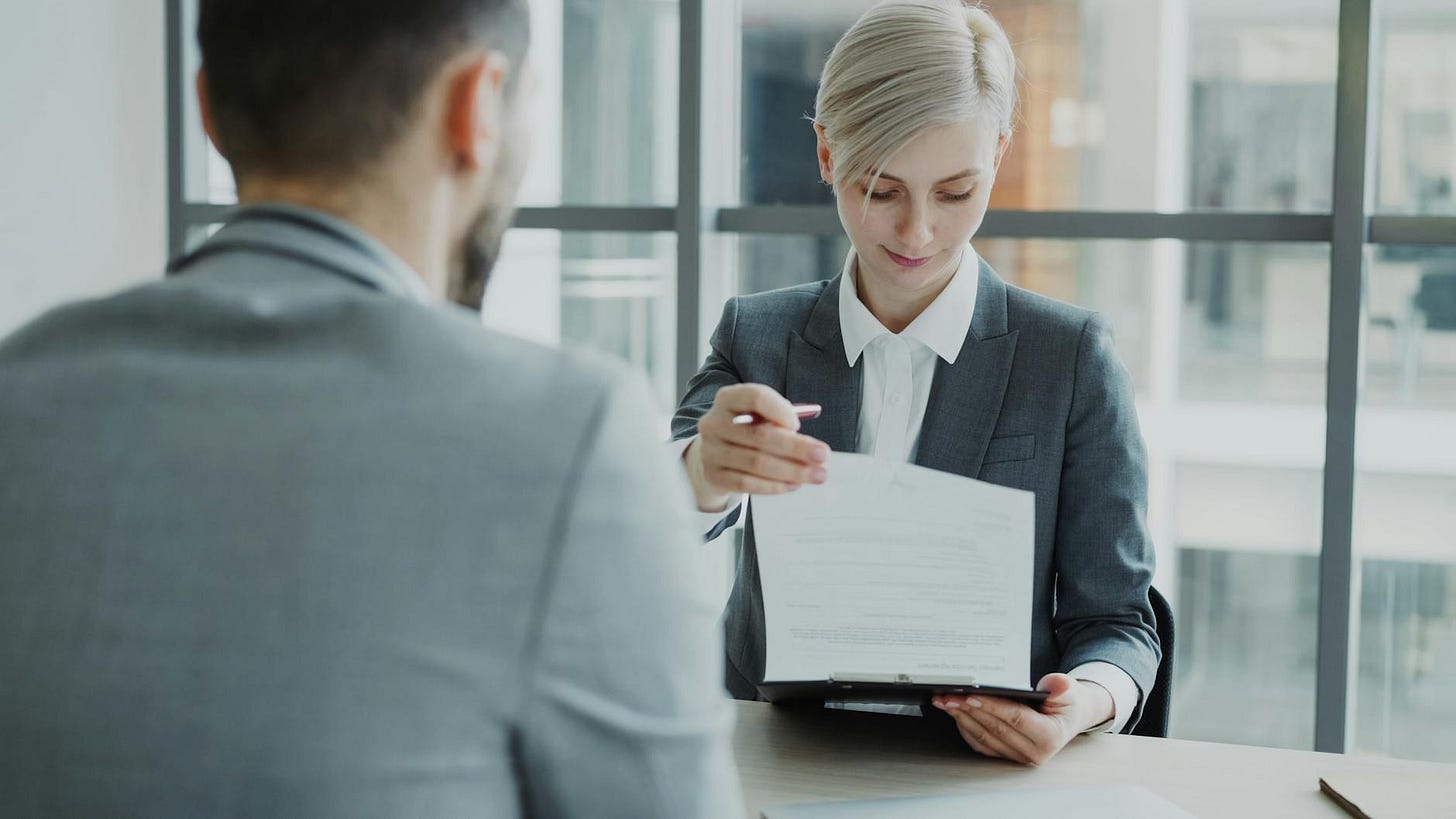 business meeting with contract review in office business meeting with contract review in office