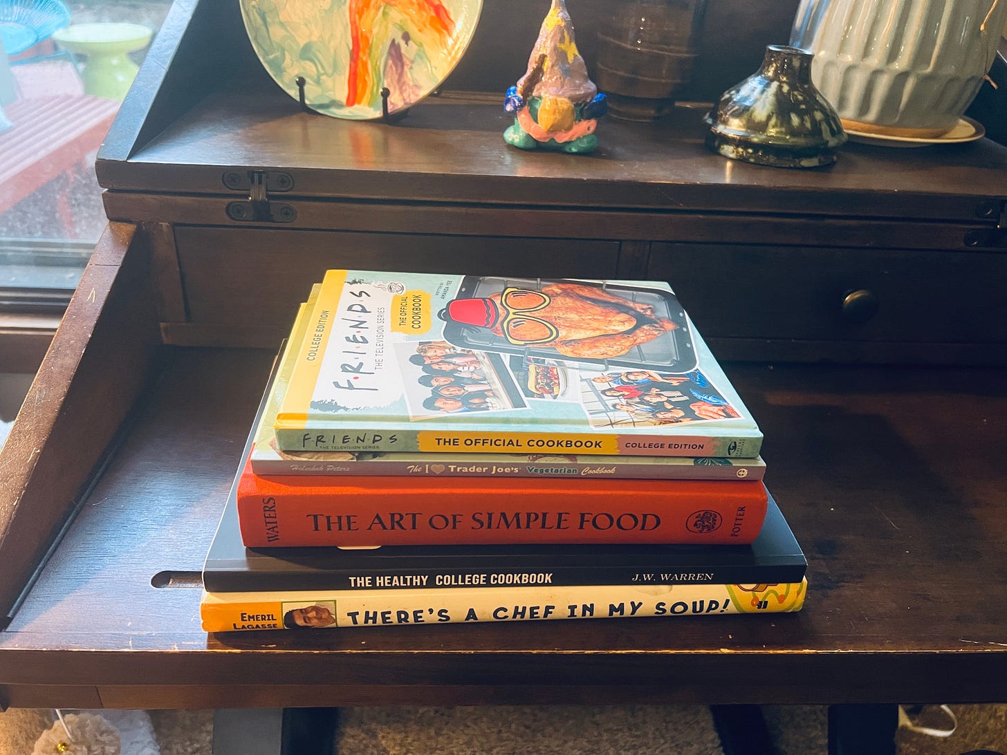 photo of a pile of cookbooks on a desk photo of a pile of cookbooks on a desk