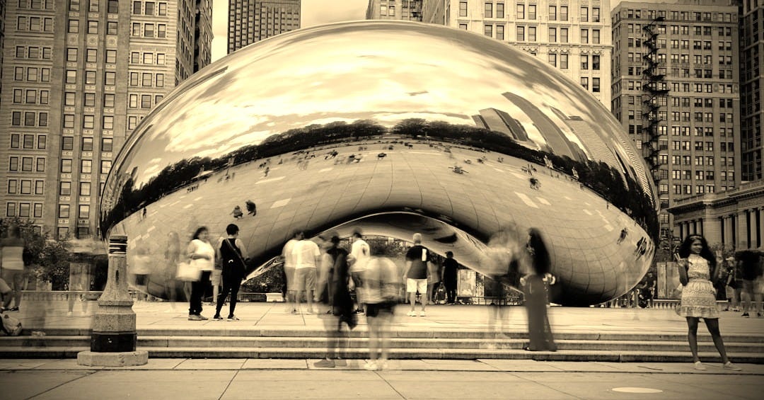 A group of people standing in front of a large metal object
