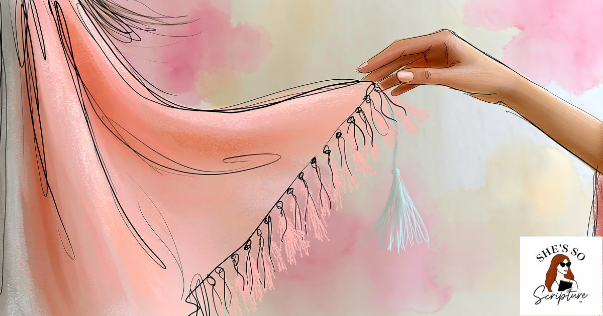 A whimsical watercolor illustration of a woman's hand reaching toward the fringed corner of a garment with delicate blue-threaded tassels, in blush pink and cream tones. A whimsical watercolor illustration of a woman's hand reaching toward the fringed corner of a garment with delicate blue-threaded tassels, in blush pink and cream tones.