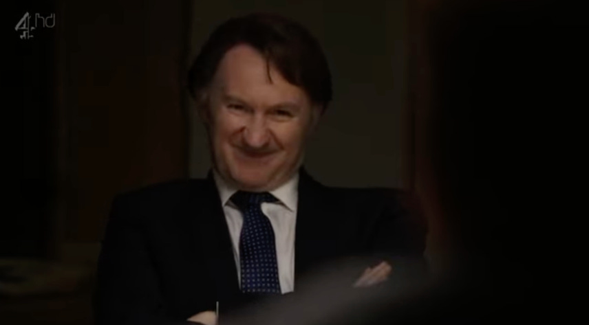 A person in a suit and tie

AI-generated content may be incorrect.