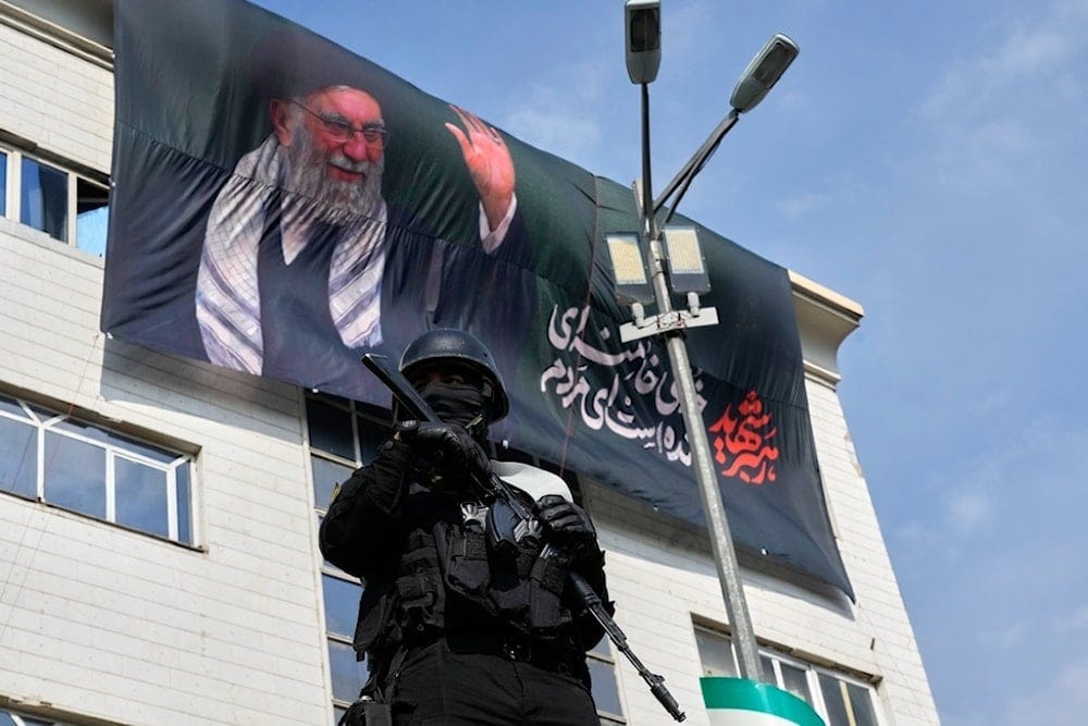 A security officer stands guard during a demonstration in support of the nomination of Sayyed Mojtaba Khamenei as the new leader and successor to his father, martyr Sayyed Ali Khamenei, in Tehran, Iran, Monday, March 9, 2026. (AP Photo/Vahid Salemi) A security officer stands guard during a demonstration in support of the nomination of Sayyed Mojtaba Khamenei as the new leader and successor to his father, martyr Sayyed Ali Khamenei, in Tehran, Iran, Monday, March 9, 2026. (AP Photo/Vahid Salemi)