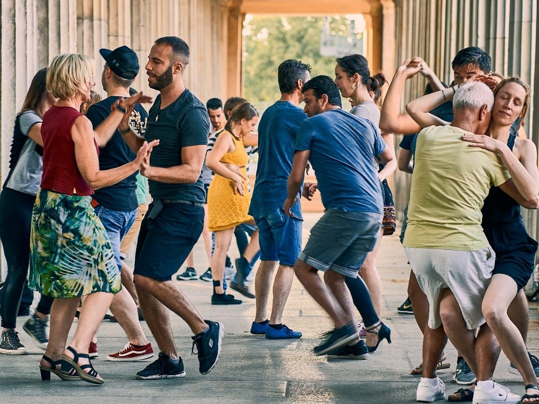 a group of people dancing a group of people dancing