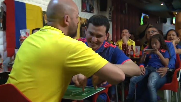 Colombian Man Helps His Blind & Deaf Friend Enjoy the World Cup by Moving His Hands With Each Play Colombian Man Helps His Blind & Deaf Friend Enjoy the World Cup by Moving His Hands With Each Play