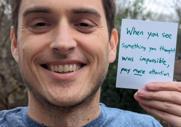 Ryan holding sign Ryan holding sign