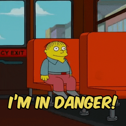 a cartoon character sitting on a bus with the words i 'm in danger above him