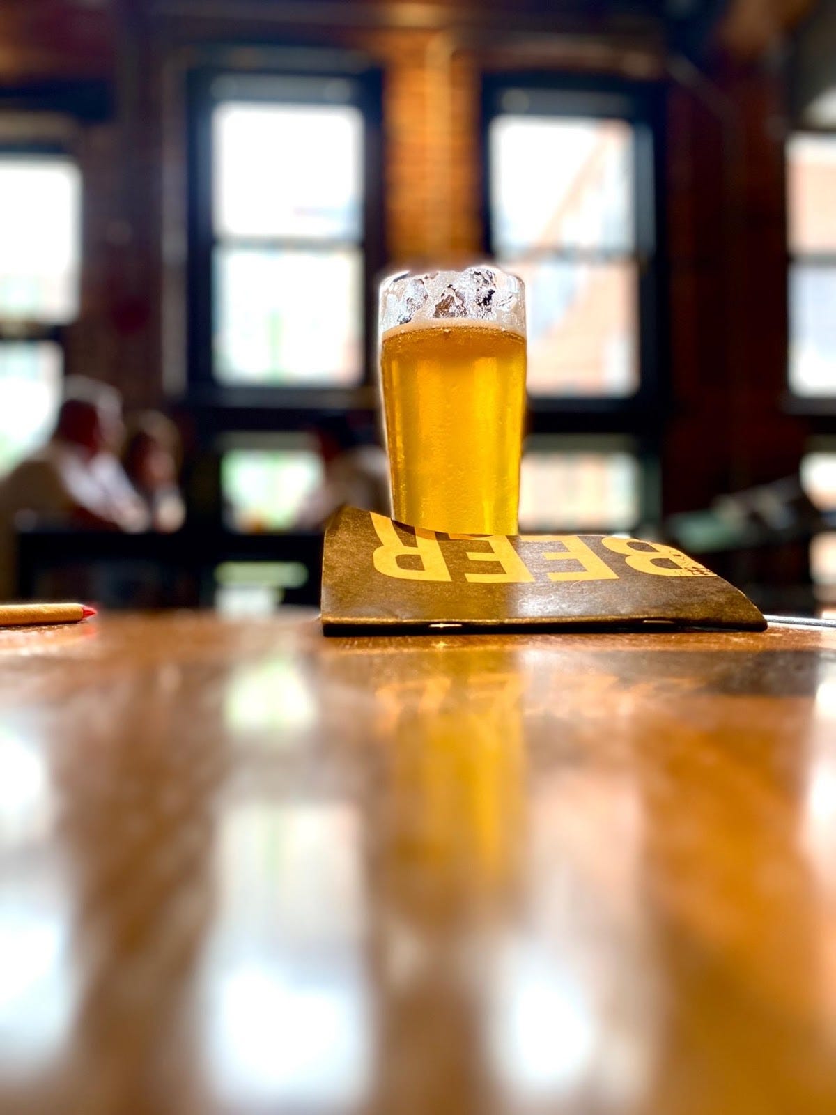 A glass of beer on a table

Description automatically generated with medium confidence