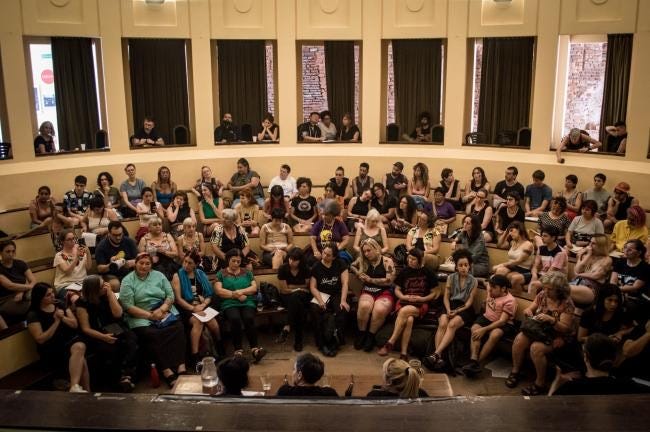 A group of people sitting in a circle
AI-generated content may be incorrect. A group of people sitting in a circle
AI-generated content may be incorrect.