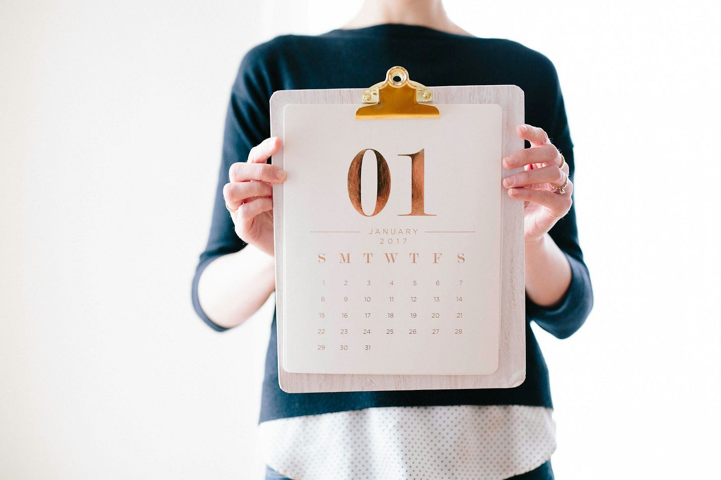 Someone holding a calendar