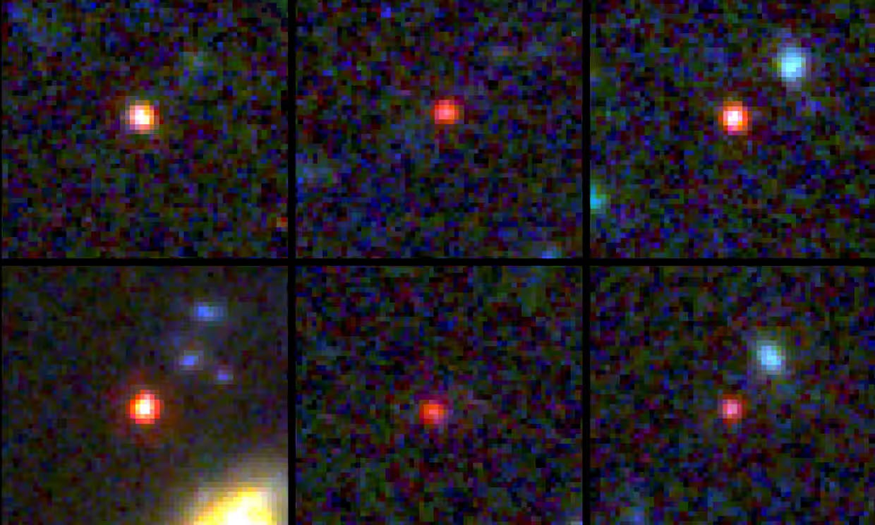 Six small red dots against a fuzzy blue-black background showing the light from six ancient galxies. Six small red dots against a fuzzy blue-black background showing the light from six ancient galxies.