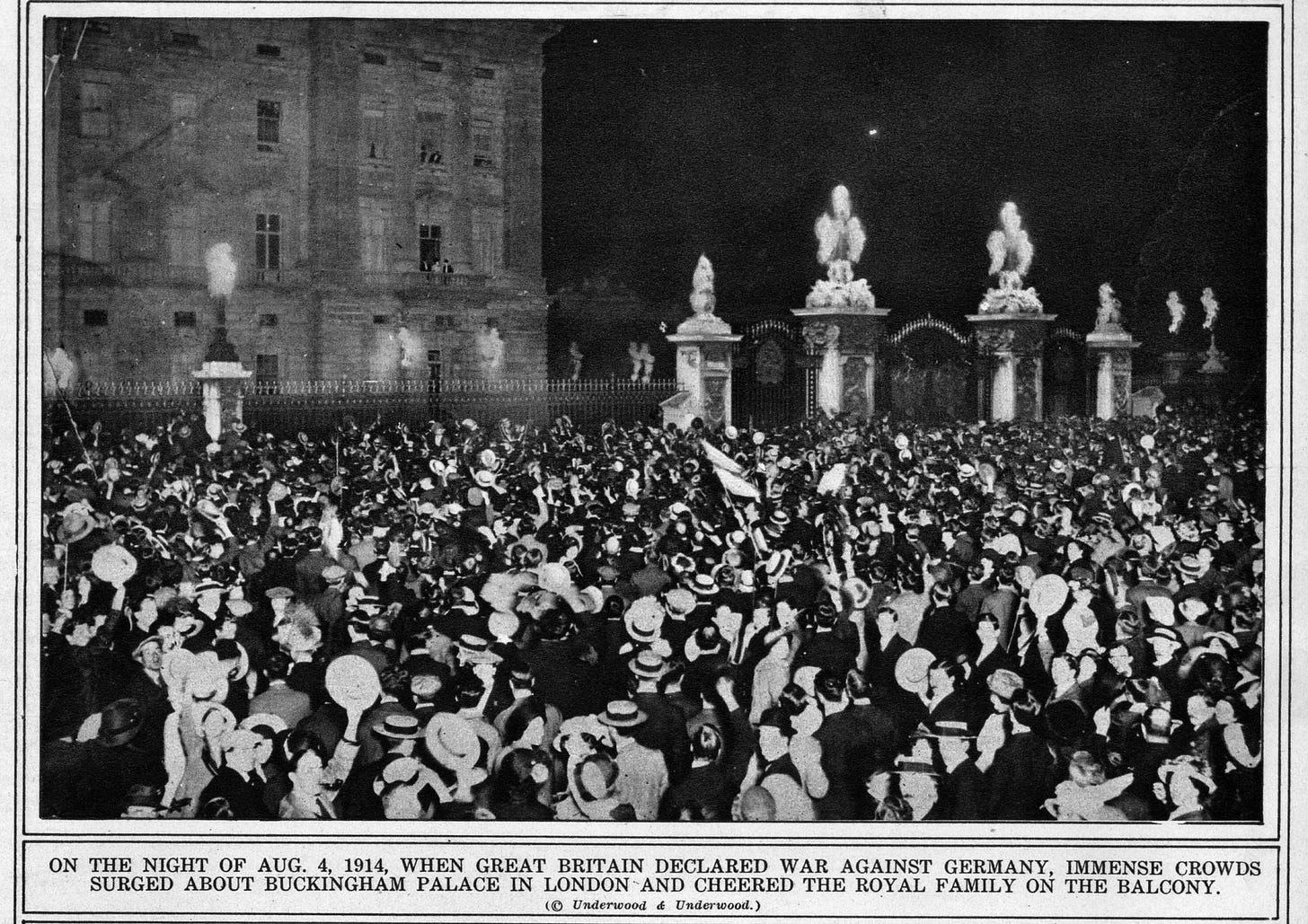Image of celebrating Londoners. Their faces look whitewashed because the photo is old.