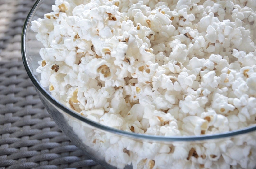 popcorn in clear glass bowl popcorn in clear glass bowl
