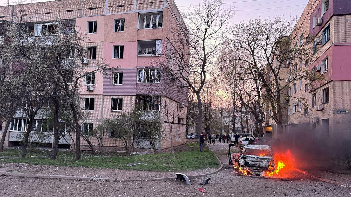 A car burns after an attack on residential buildings in Ukraine