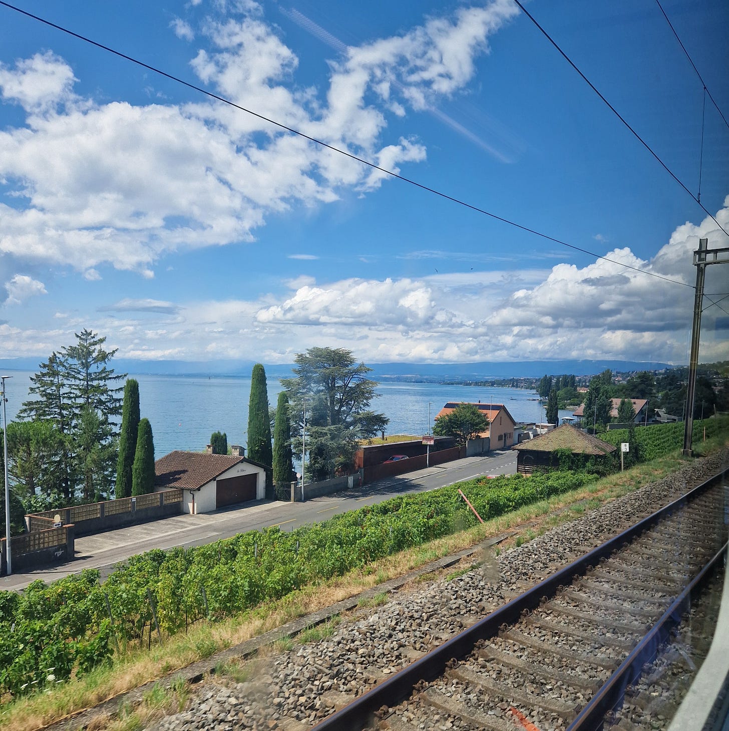Railway line with large blue lake behind Railway line with large blue lake behind