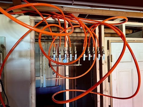 Photos of PEX being installed and a pressure gauge showing it pressurized to 100 psi.