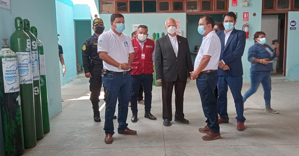 Then-Bishop Robert Prevost, center, attends the inauguration of an oxygen plant in Mochumí, Peru, which he helped establish in 2021 during the COVID-19 pandemic. (Courtesy of Janina Sesa)