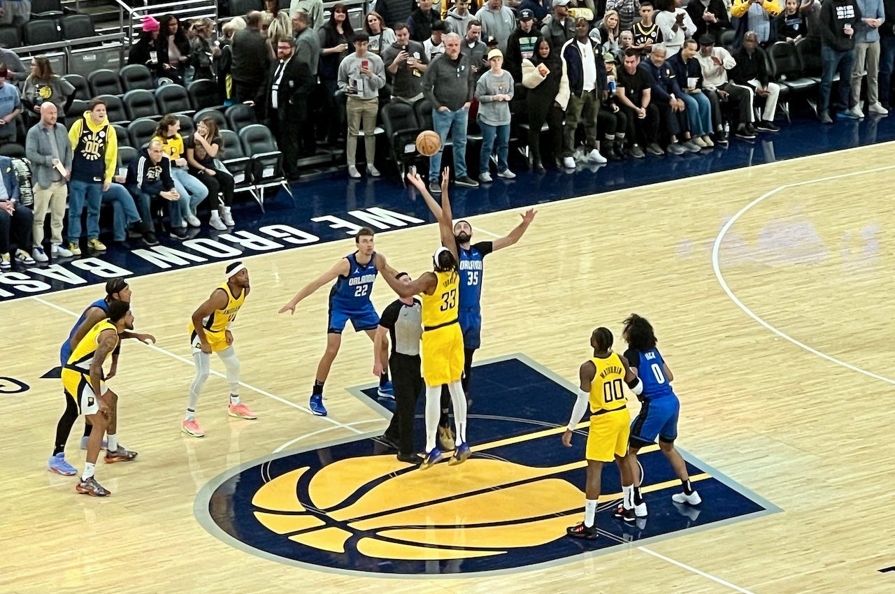 Myles Turner jumps center against former Pacer Goga Bitadze.