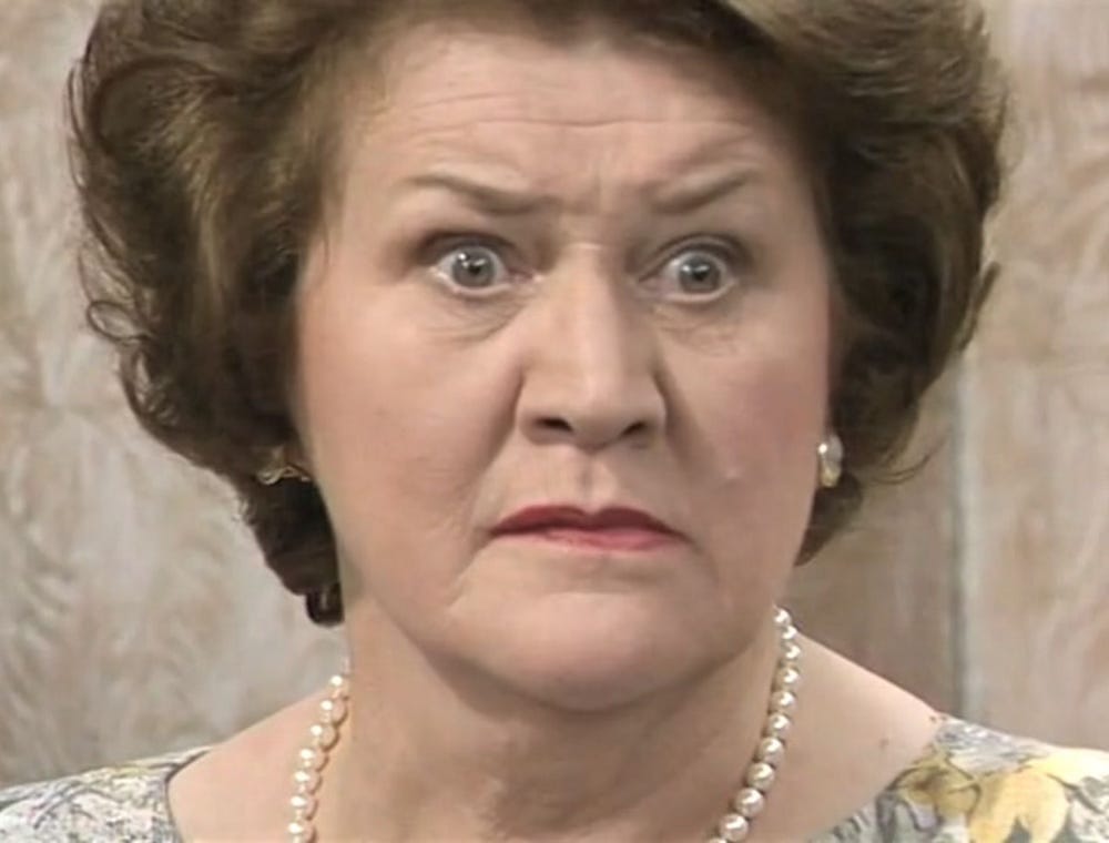 Patricia Routledge as Hyacinth Bucket in Keeping Up Appearances, looking startled