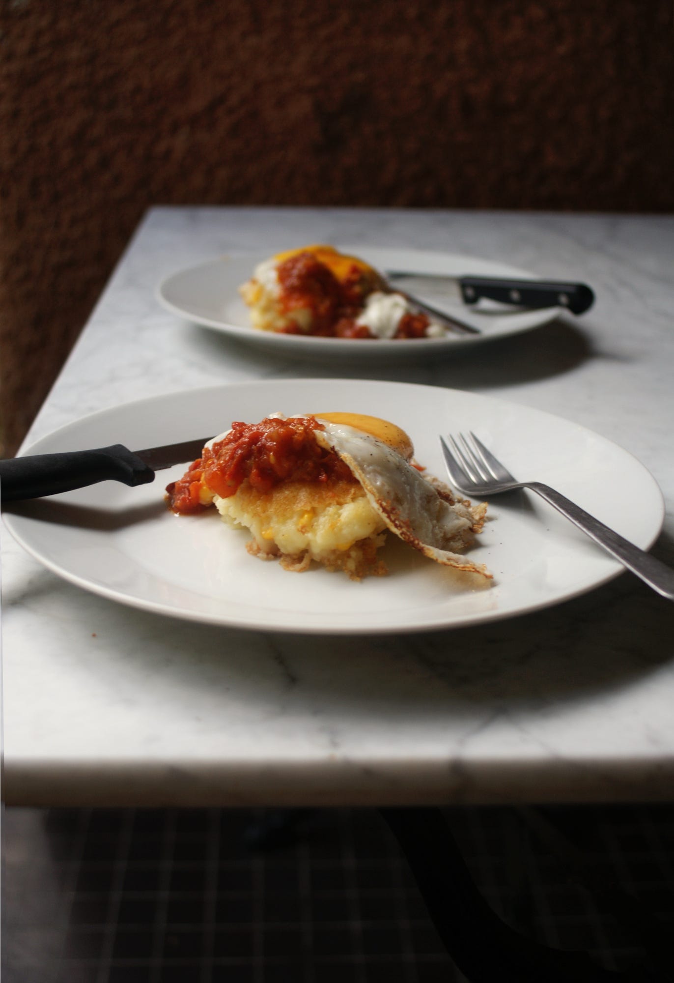 Mashed potato cakes and fried eggs