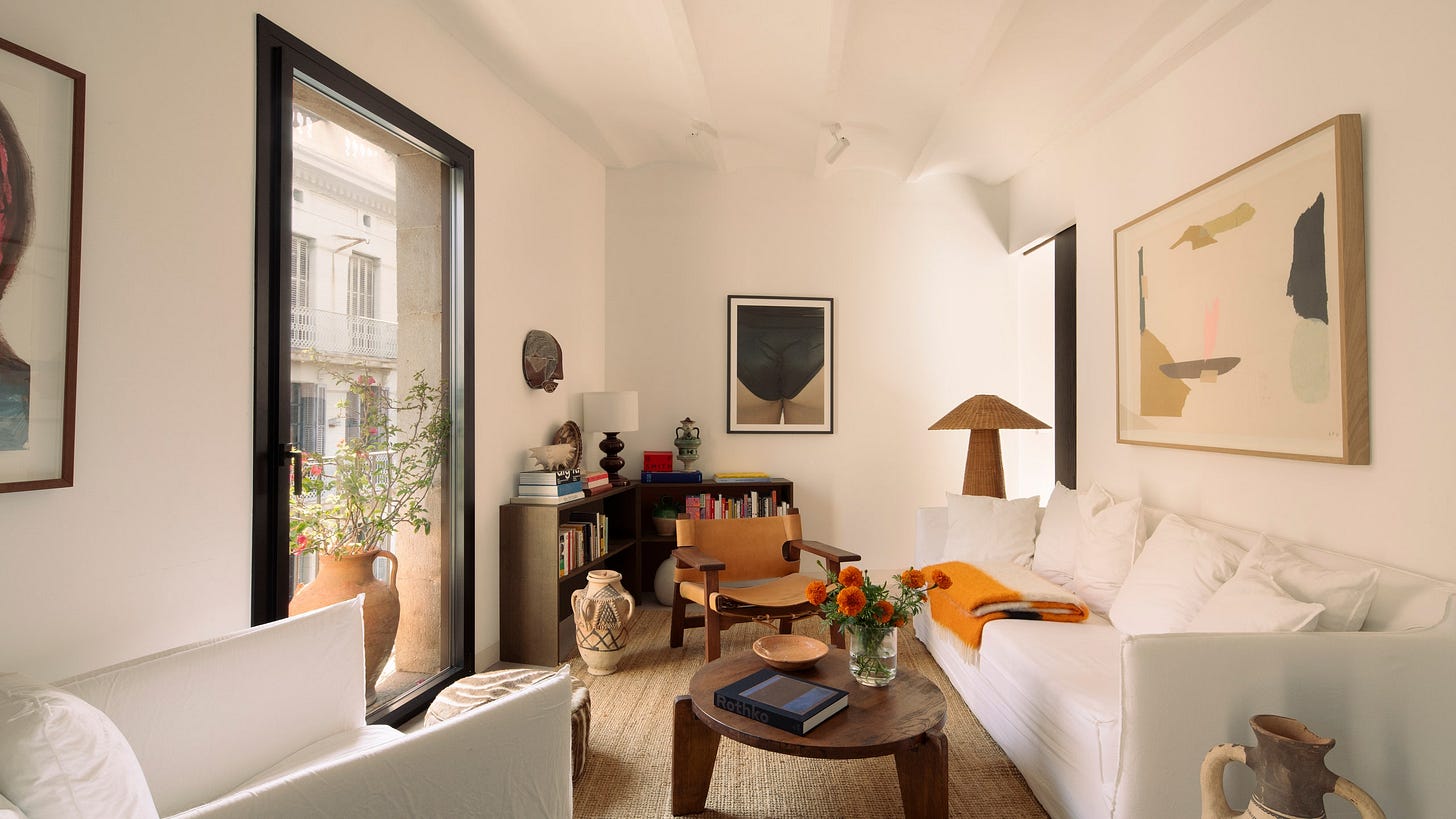 Image may contain Architecture Building Furniture Indoors Living Room Room Home Decor Couch Table Corner and Book