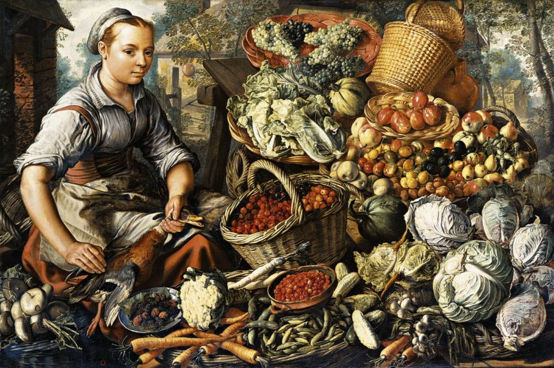 A woman sits behind a huge spread of vegetables, poultry and baskets at a market stall A woman sits behind a huge spread of vegetables, poultry and baskets at a market stall
