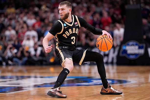 Braden Smith of the Purdue Boilermakers looks on during the second half of a game against the Arizona Wildcats in the Elite Eight of the 2026 NCAA... Braden Smith of the Purdue Boilermakers looks on during the second half of a game against the Arizona Wildcats in the Elite Eight of the 2026 NCAA...