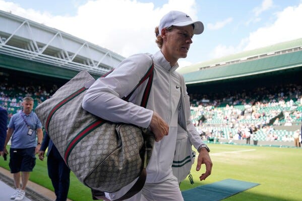 Italy's Jannik Sinner walks off court after defeating Colombia's Daniel Elahi Galan in the men's singles match on day seven of the Wimbledon tennis championships in London, July 9, 2023. (AP Photo/Alberto Pezzali, File)
