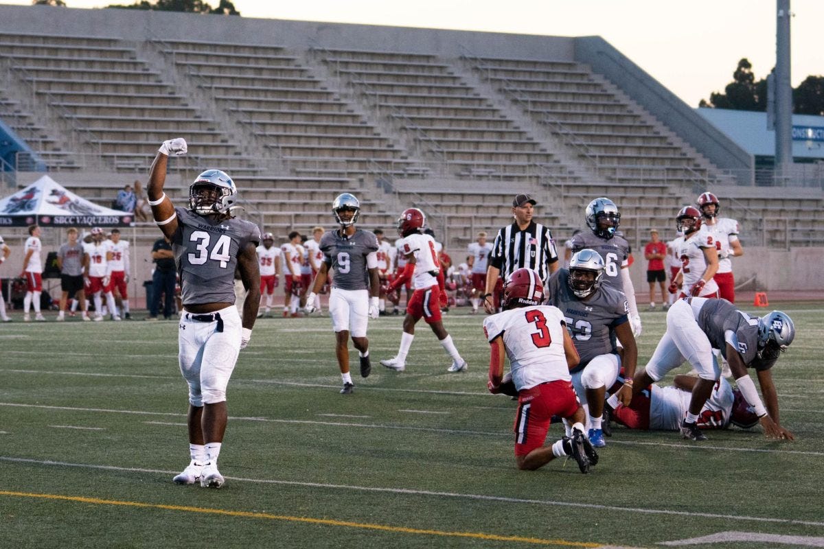 El Camino linebacker Jalen Birdsong stops the run, and Santa Barbara gains no yards on the play at Murdock Stadium on Aug. 30. Birdsong doing the perfect timing celebration. (Ryan Hirabayashi | The Union)