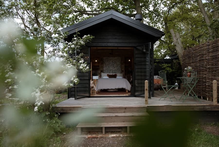 wooden hut raised within the woodlands